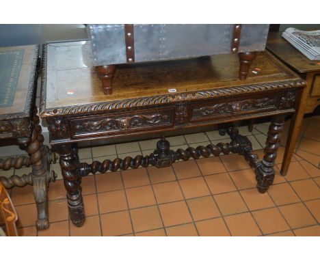 A LATE 19TH/EARLY 20TH CENTURY CARVED OAK SIDE TABLE, with two drawers on four barley twist legs united by matching stretcher