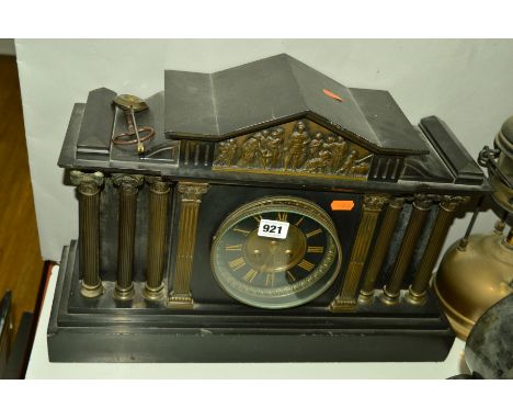 A SLATE MANTLE CLOCK, having three Roman style pillars to each side of the dial and Roman embossed decorative scene above the