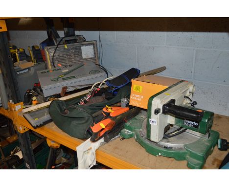 A TOLENDO TKZ-205 COMPOUND MITRE SAW together with a tile cutter, pro tiler measure 'N' cut, metal cased screw set, various h