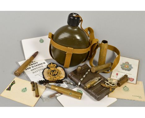 A US STYLE POST WWII WATER BOTTLE, green screw top, with canvas carry strapping, selection of small ammunition shell cases so