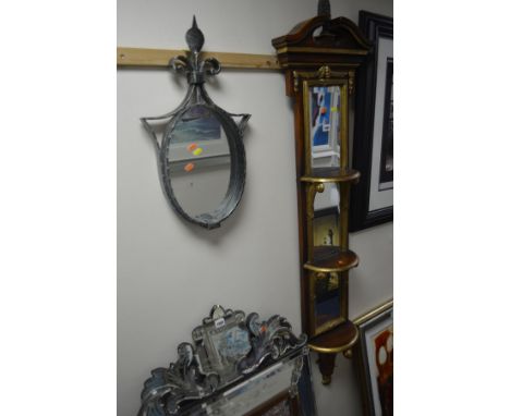 A SLIM REPRODUCTION HARDWOOD AND GILT BEVELLED EDGE WALL MIRROR/TRIPLE WALL SHELF together with a wrought iron oval wall mirr