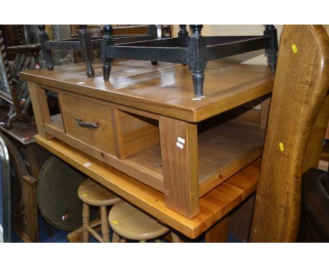 A MODERN PINE COFFEE TABLE with one drawer, 125cm x 70cm x 27cm height, and an oak hanging single shelf 133cm wide (2)