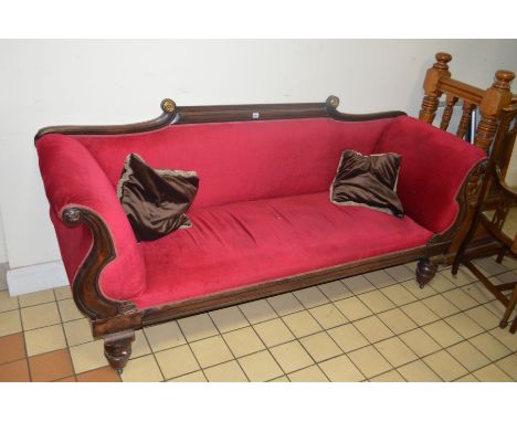 A VICTORIAN MAHOGANY SOFA with scrolled back and arms on bulbous legs and ceramic casters, width 210cm