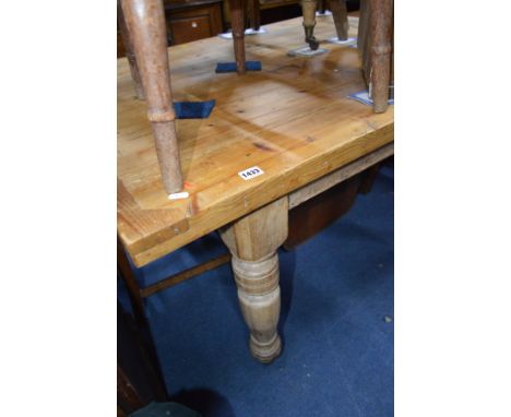 A VICTORIAN BLEACHED WALNUT TABLE BASE with brass and ceramic cup casters and a more recent pine top, width 122cm x depth 92c