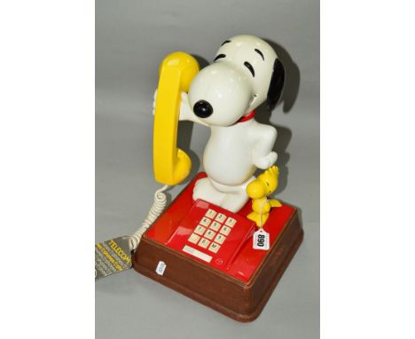 A BOXED TELECOM 'SNOOPTY' TELEPHONE, with push button dial (box distressed)