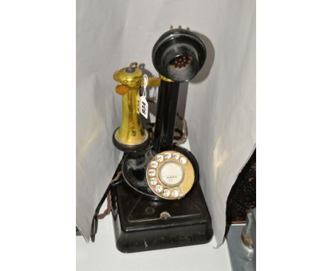 A CANDLESTICK TELEPHONE, adapted for current day use, having brass ear-piece rest and collar