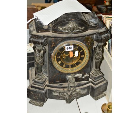 A SLATE MANTLE CLOCK (some restoration required), having carved pillars in the form of Greek women, carved base and upper car