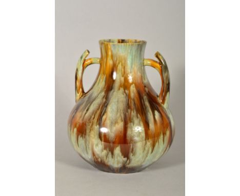 AN ART NOUVEAU STUDIO POTTERY TWIN HANDLED VASE, the body being covered in a streaked glaze, unmarked to the base, similar in