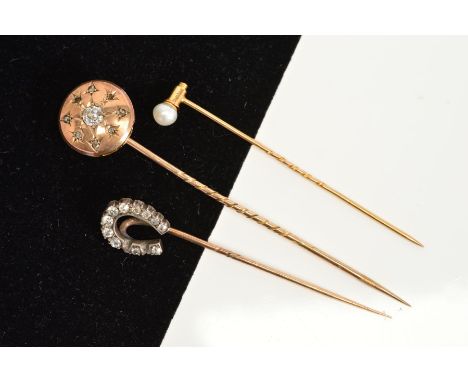 TWO VICTORIAN GOLD AND DIAMOND STICKPINS, the first with a round domed disc, centring on an old European cut diamond measurin