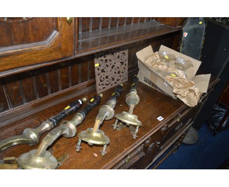 A SET OF FOUR CASKELL AND CHAMBERS BRASS AND CERAMIC BEER PUMPS, together with a cast iron foliate vent cover and a box conta
