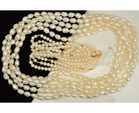 TWO FRESH WATER CULTURED PEARL NECKLACES, the first designed as a three row necklace with spherical gold coloured spacers at 
