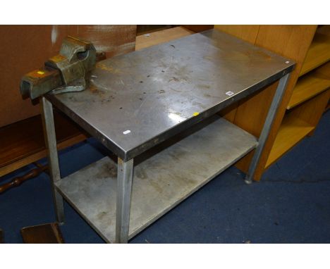 A STAINLESS STEEL WORK BENCH/TABLE, with table top vice
