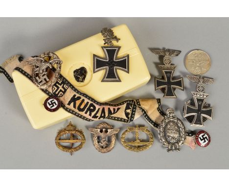 A BOX CONTAINING A NUMBER OF 3RD REICH WWII BADGES, PINS etc, to include Iron Crosses with 1939 spange all one piece, U Boat 