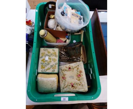 Collection of sewing accessories including vintage cotton reels, pincushions, thimbles, vintage plastic buttons, military but