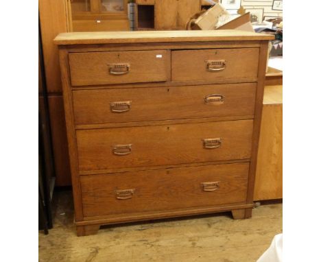 Arts & Crafts style oak chest of two short and three long graduated drawers, all with copper angular handles and geometric pi