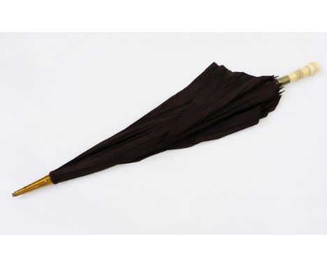 Large black vintage spy umbrella with a carved bone removable handle, having brass telescope/spy glass to the core