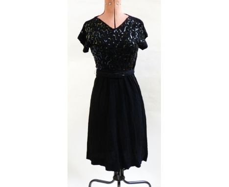 Five various vintage dresses, a blue suede coat labelled 'Clarissa Ultra Suede' and a gentleman's silk paisley dressing gown 
