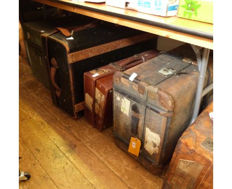 Two vintage trunks, a leather suitcase carrying shipping labels and a large vintage tin travel trunk (4) 