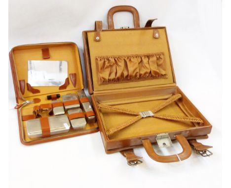 Vintage travelling case with fittings but no fitments, a leather fitted travel case with glass containers, mirror, but lackin