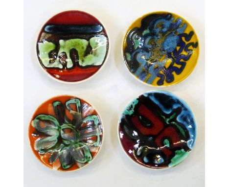 Four Poole Delphis pottery circular trinket dishes, model no.49 by Angela Wyburgh (1968-72), Carol Holden, Patricia Churchous