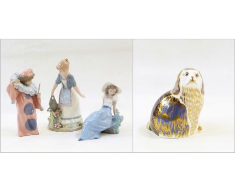 Nao figure of child dressed as a clown, another of girl wearing hat with bird, another Spanish china figure and a Royal Crown