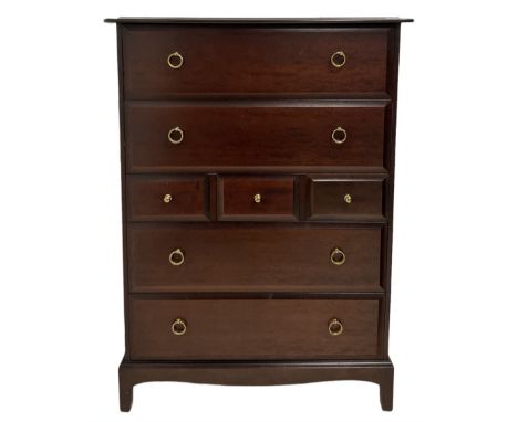 Stag Minstrel - mahogany chest of drawers, fitted with four long and three short drawers, raised on bracket supports