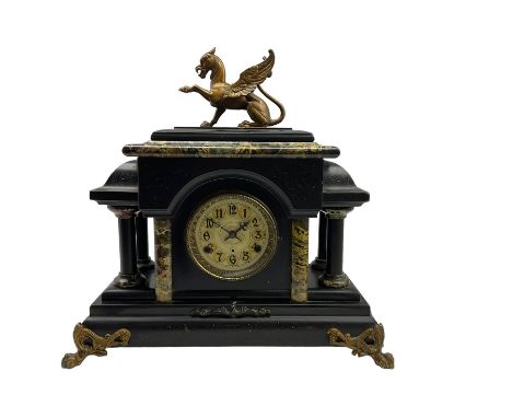 Late 19th century New Haven American mantle clock in a wooden simulated slate and marble case, pediment with a flat top surmo