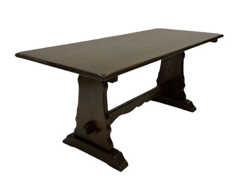 20th century oak refectory table, the rectangular top raised on panel end supports with sledge feet, united by a stretcher Di