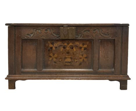 19th century oak coffer, the hinged lifting lid over blind carved frieze and panelled base, raised on bracket supports Dimens