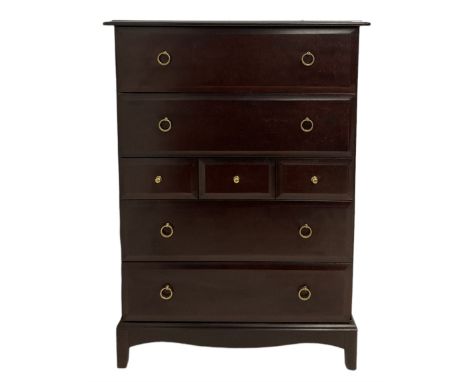Stag Minstrel - mahogany chest of drawers, fitted with four long and three short drawers, raised on bracket supports 