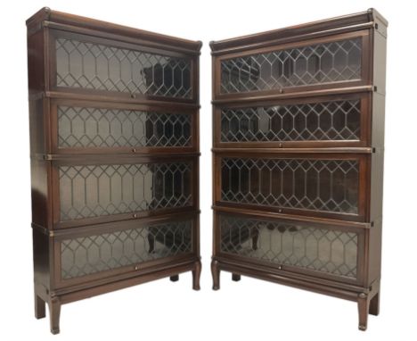 Globe Wernicke - pair of four sectioned bookcases, fitted with four up and over lead glazed doors, raised on cabriole support