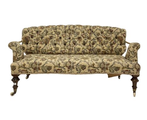 19th century walnut and metal framed settee, upholstered in buttoned foliate patterned fabric, turned front supports with bra