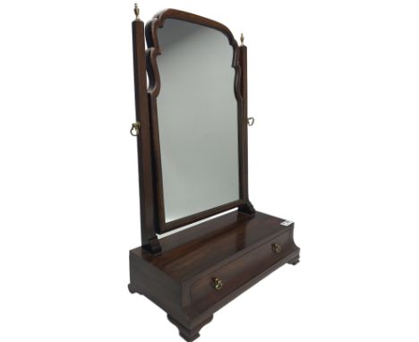Georgian design mahogany swing mirror, one adjustable mirror with two uprights, surmounted by brass finials over one drawer, 