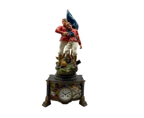 Spelter cased mantle clock with a French striking movement c1905, case with a depiction of two English Boar War solders in co