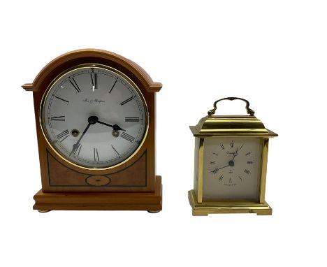 Two 20th century mantle clocks. A light maple wooden cased 8-day mantle clock and a quartz carriage clock in a brass effect c
