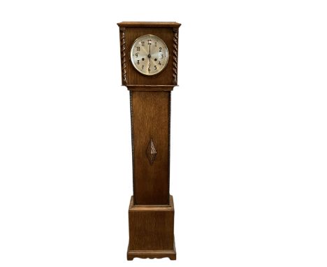 Mid-20th century oak cased Grandmother clock striking the hours and half-hours on a coiled gong,  with a silvered dial, Arabi