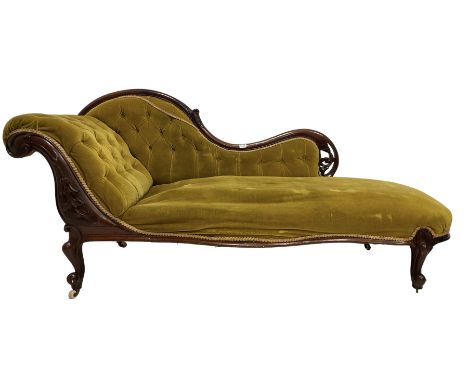 Victorian buttoned back chaise lounge, upholstered in citrine velvet, raised on cabriole supports, terminating in ceramic cas