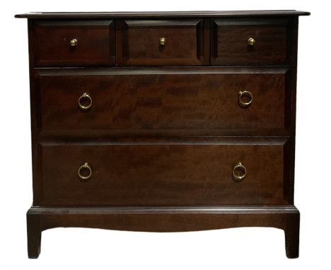 Stag Minstrel - mahogany chest of drawers, fitted with three short and two long drawers, raised on bracket supports 