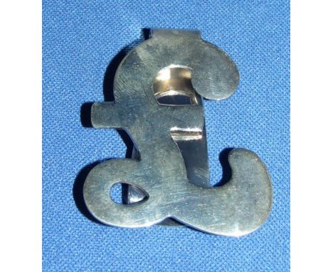 A silver pound sign money clip
We will post this item worldwide at cost.