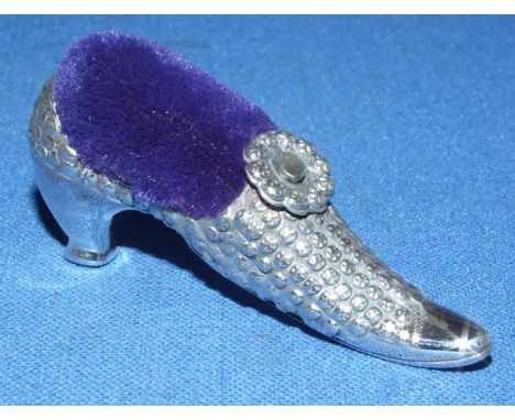 A silver shoe pin cushion
We will post this item worldwide at cost.