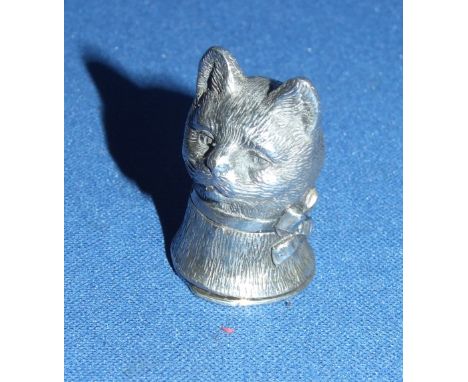 A silver cat vesta box
We will post this item worldwide at cost.