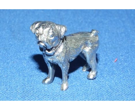 A silver pug dog
We will post this item worldwide at cost.