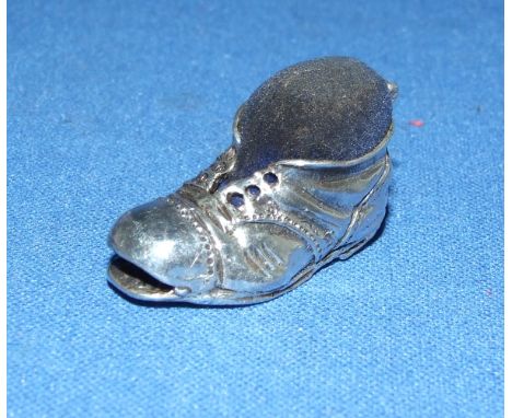 A novelty silver boot pin cushion
We will post this item worldwide at cost.