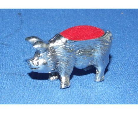 A silver pig pin cushion
We will post this item worldwide at cost.