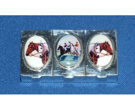 A silver three sectioned pill box, decorated horse racing, 5 cm wide
We will post this item worldwide at cost.