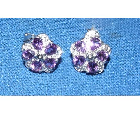 A pair of silver, amethyst and diamond earrings
We will post this item worldwide at cost.