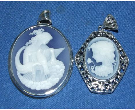 Two silver cameo pendants
We will post this item worldwide at cost.