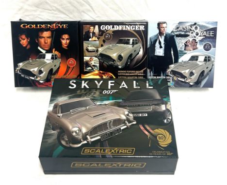 James Bond 007 Scalextric Cars x 4 James Bond 007 Scalextric Cars x 4 including Goldfinger Aston Martin DB5, Goldeneye Aston 