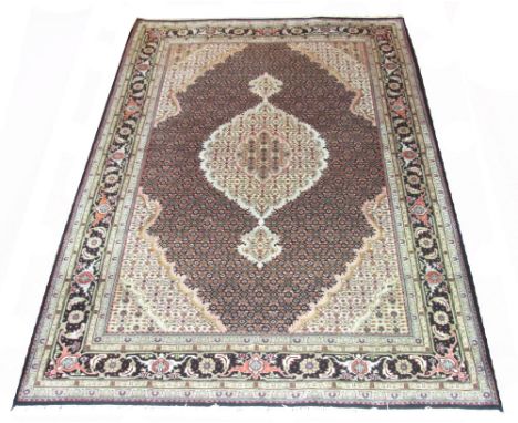 FINE PART SILK BIOJA, 276cm x 192cm, 'Tabriz' design of a palmette medallion 'en-pierre' on a deep amethyst field within corr