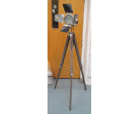 STUDIO LAMPS, a pair, in a chromed metal finish on extendable wooden tripod supports, 153cm H. (2)